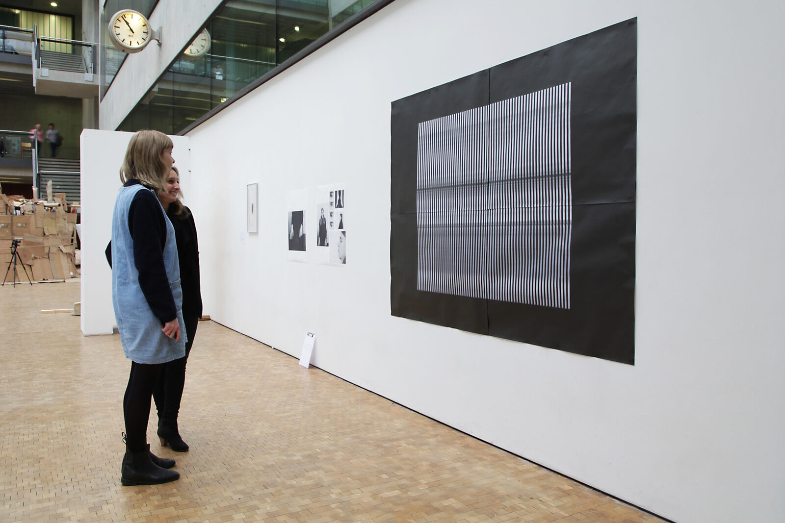 A black field carrying horizontal bands of fine vertical white strokes