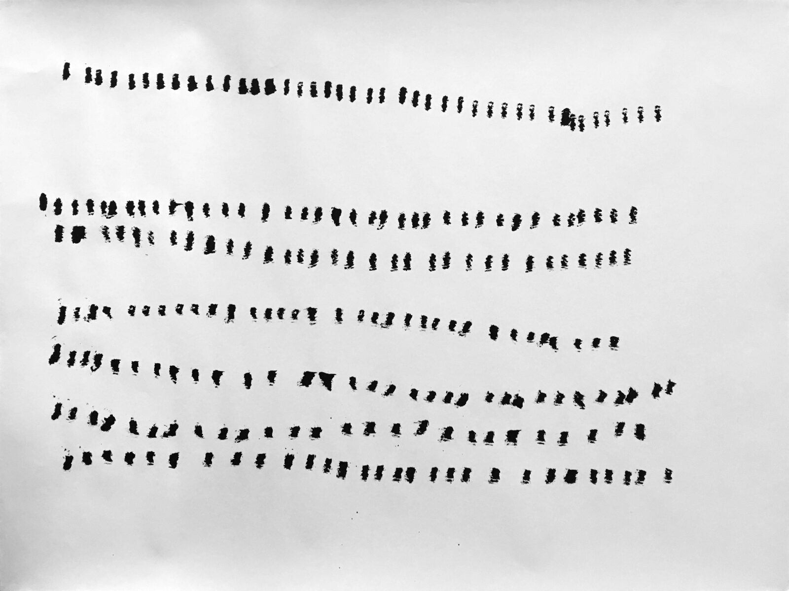 A sheet carrying six loose rows of short strokes, the second row markedly straighter than the rest