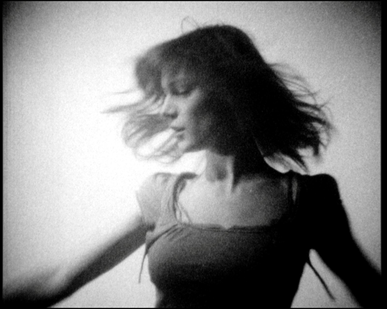 The face lifted and blurred in a sweep of light, one arm thrown down to the left