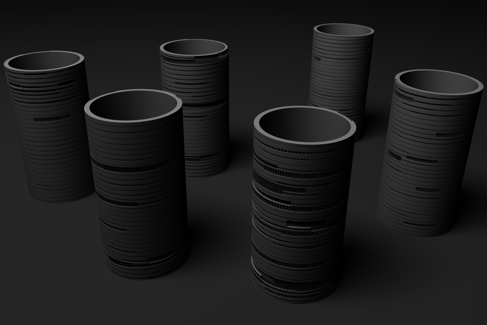 Rendering of six dark grey cylinders standing on a dark ground, the two in front the nearest, each cut with its own pattern of grooves and blocks