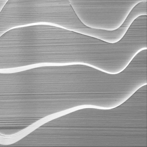 The printed layers in grey light, pale contour ridges running across them, and a dark crack cutting straight through the layers below the middle